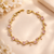 Pink Crystal Wave Tennis Bracelet – Anti-Tarnish Gold
